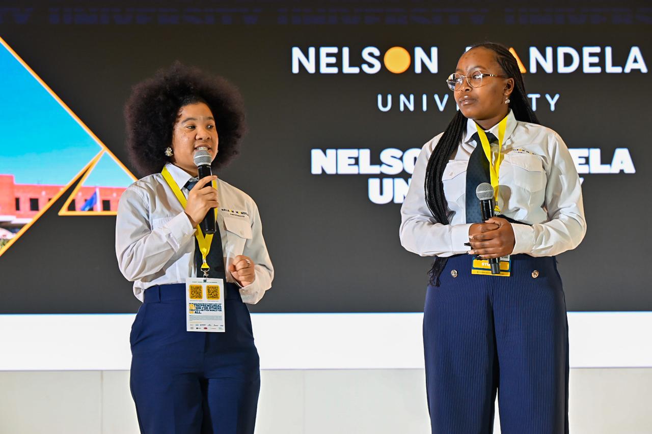Nicole and Katekani from Enactus Nelson Mandela University present on stage at the 2025 Expo.